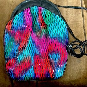 Multicolored bag with patent leather strap